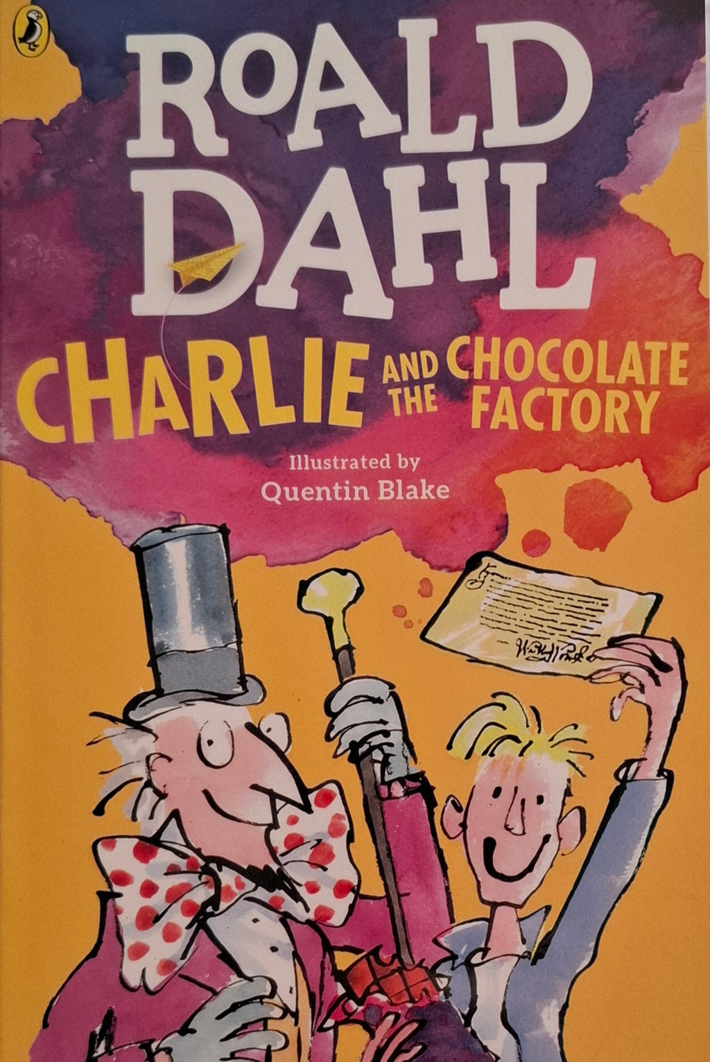 Book cover of 'Charlie and the Chocolate Factory' by Roald Dahl with colorful design and illustrations.